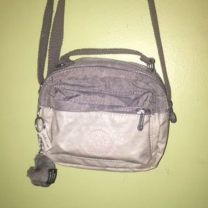 Ivory and light gray adjustable Kipling bag